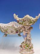 TWO MEISSEN TWO HANDLED BASKETS, ONE SUPPORTED BY TWO CHILDREN STANDING ON A ROCKY PLINTH. H