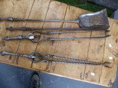 A SET OF THREE 19th.C.STEEL FIRE IMPLEMENTS L.72cms.AND A FURTHER SET OF TONGS