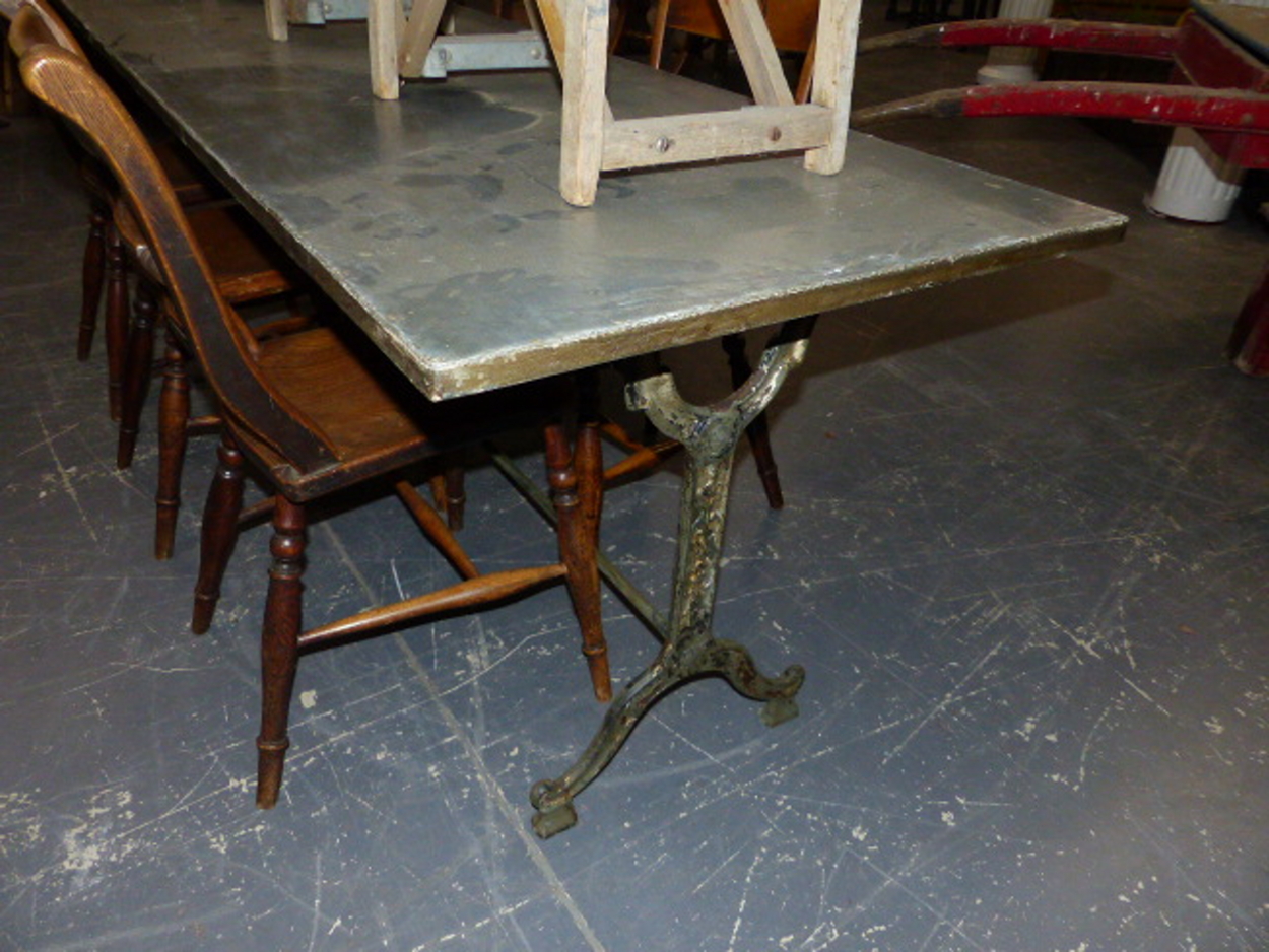 A SET OF THREE CAST IRON BASED TABLES WITH CAST IRON TRESTLE BASES AND ZINC WRAPPED TOPS. 69 x 210 x - Image 4 of 11