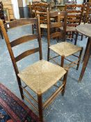 A SET OF FOUR 19th.C.ASH AND RUSH SEAT LADDER BACK SIDE CHAIRS. (4)