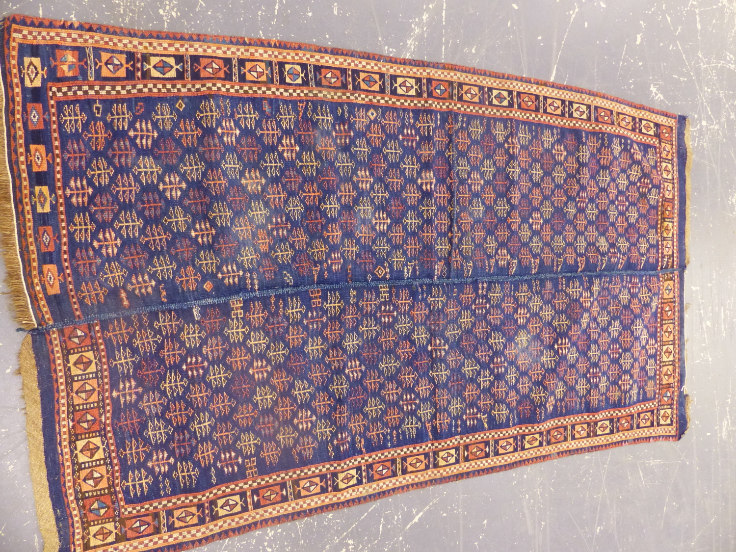 A PERSIAN TRIBAL FLAT WEAVE RUG. 195 x 110cms.