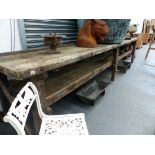A VERY LARGE ANTIQUE PINE WORK BENCH WITH UNDER TIER. 431 x 85 x H.85cms.