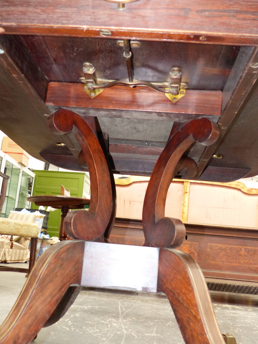 A REGENCY ROSEWOOD AND BRASS INLAID TILT TOP BREAKFAST TABLE ON QUADRUPED SABRE LEGS. 98 x 140 x H. - Image 3 of 14