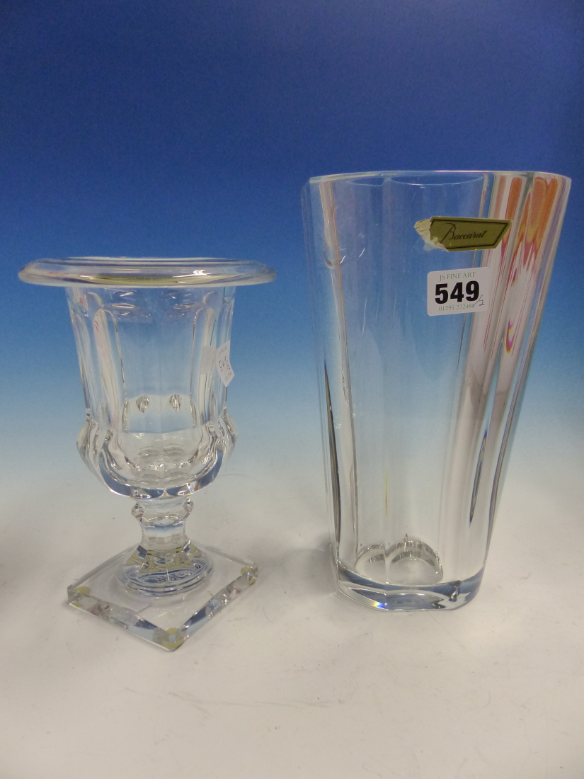 A BACCARAT CLEAR GLASS URN. H 21cms. TOGETHER WITH A TAPERING OCTAGONAL VASE. H 25cms.