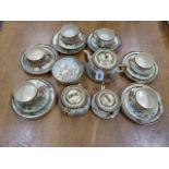 A SATSUMA POTTERY TEA SERVICE PAINTED WITH BIRDS AND FLOWERS COMPRISING SIX TEA CUPS, SAUCERS AND