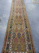 AN ANTIQUE PERSIAN TRIBAL RUNNER. 403 x 96cms.