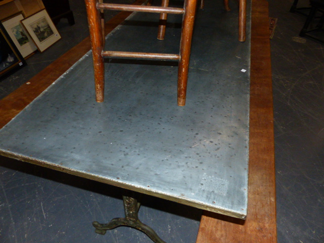 A SET OF THREE CAST IRON BASED TABLES WITH CAST IRON TRESTLE BASES AND ZINC WRAPPED TOPS. 69 x 210 x - Image 8 of 11