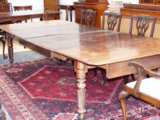 A Wm.IV.MAHOGANY EXTENDING DINING TABLE ON TURNED SPIRAL REEDED LEGS RETAINING ORIGINAL EXTENSION