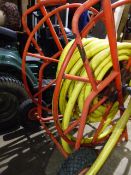 A MOUNTFIELD ROTARY MOWER. AND A HEAVY DUTY GARDEN HOSE ON REEL.