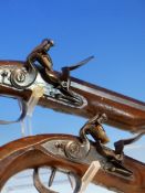 WOGDON LONDON, A PAIR OF FLINTLOCK PISTOLS, THE BRASS CAPS TO THE RAMRODS UNDER THE OCTAGONAL