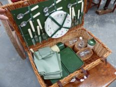 A WICKER PICNIC HAMPER.