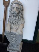 A PAIR OF GATEPOST FINIAL FIGURES OF LIONS BEARING CRESTED SHIELDS. H.82cms.