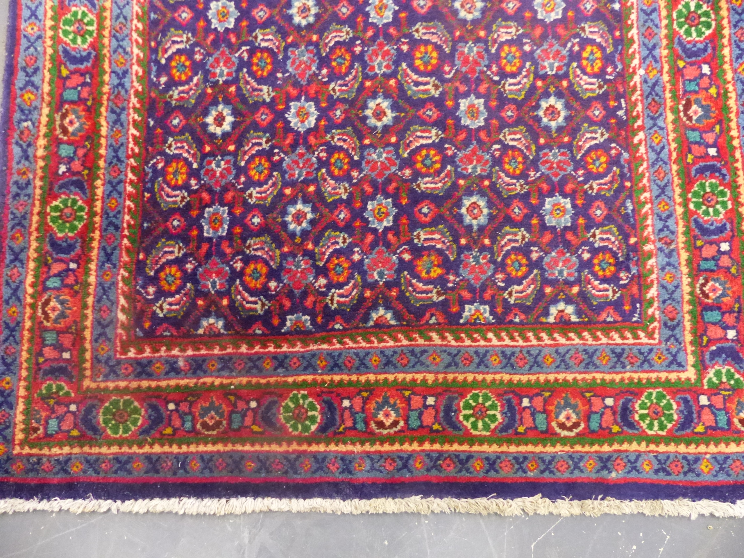 AN ORIENTAL RUG OF FEREGHAN DESIGN. 218 x 130cms. - Image 2 of 6