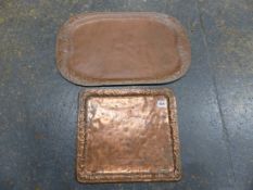 TWO ARTS AND CRAFTS COPPER TRAYS, THE LARGER WITH GRAPE VINE RIM BAND. 59 X 35.5cms THE SMALLER WITH