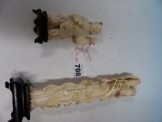 TWO CHINESE IVORY FIGURES, THE TALLER OF A LADY HOLDING UP A BASKET OF FLOWERS. H 20.5cms. THE