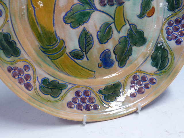 A DOULTON BRANGWYN WARE DISH WITH A WAVY BAND OF GRAPE VINES ENCLOSING A WHEATSHEAF, GRAPES AND - Image 5 of 10