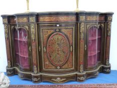 A LARGE BOULLE CREDENZA OF SERPENTINE FORM WITH GLAZED SIDE CABINETS FLANKING A CENTRAL BOW FRONT