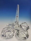 FOUR VARIOUS BACCARAT ASHTRAYS, A CUBE PAPERWEIGHT AND AN OBELISK. H 38cms.