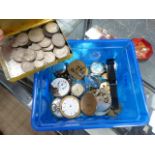 A QUANTITY OF WRIST AND POCKET WATCH MOVEMENTS AND A COLLECTION OF COINS.