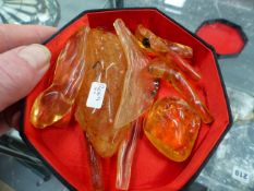 ELEVEN PIECES OF MADAGASCAN AMBER WITH INSECT INCLUSIONS.