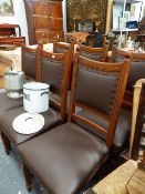 A SET OF SIX ARTS AND CRAFTS OAK DINING CHAIRS.