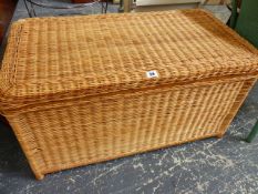 A RATTAN OTTOMAN.