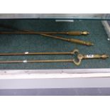 A SET OF VICTORIAN BRASS FIRESIDE TOOLS.