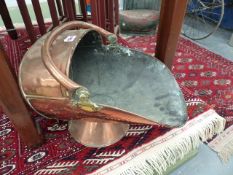 A VICTORIAN COPPER COAL SCUTTLE.