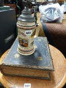 AN ANTIQUE FAMILY BIBLE AND A BEER STEIN.