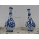 A PAIR OF BLUE AND WHITE VASES.