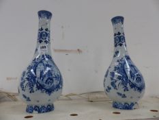 A PAIR OF BLUE AND WHITE VASES.