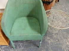 A LOOM CHAIR AND A WROUGHT IRON SMALL TABLE.