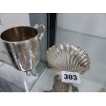 A HALLMARKED SILVER SHELL DISH AND A CHRISTENING CUP.