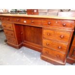 A VICTORIAN MAHOGANY PEDESTAL KNEEHOLE DESK.