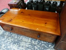 A LARGE SINGLE DRAWER OTTOMAN.