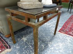 A SET OF THREE BRASS FRAMED COFFEE TABLES.