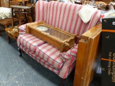 A WING BACK COTTAGE SETTEE.