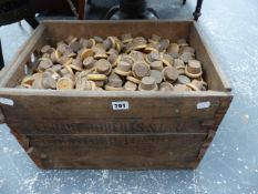 A VINTAGE PINE CRATE AND QTY OF CORK BOTTLE STOPPERS.