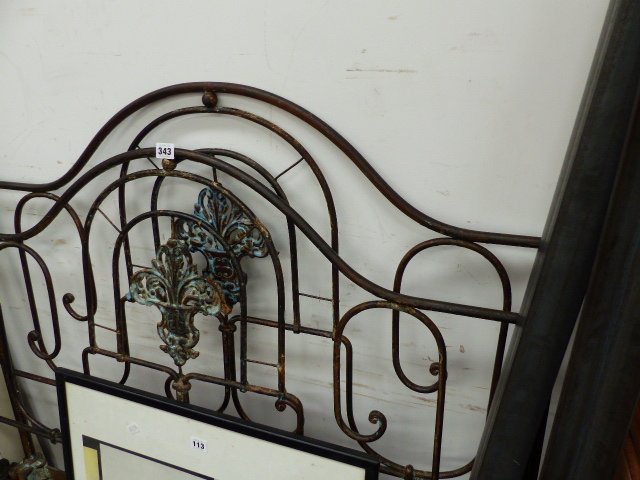 AN ANTIQUE BRASS AND IRON BED.