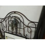 AN ANTIQUE BRASS AND IRON BED.