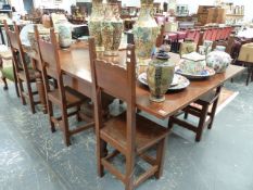 A LARGE DRAW LEAF EXTENDING DINING TABLE AND SIX CHAIRS.