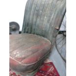 A VINTAGE CAR SEAT.