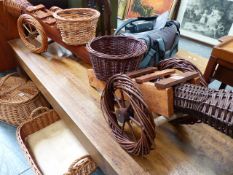 TWO WICKER CANNON PLANTERS.