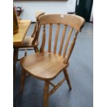 A SET OF SIX SLAT BACK KITCHEN CHAIRS.