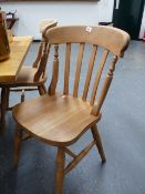 A SET OF SIX SLAT BACK KITCHEN CHAIRS.