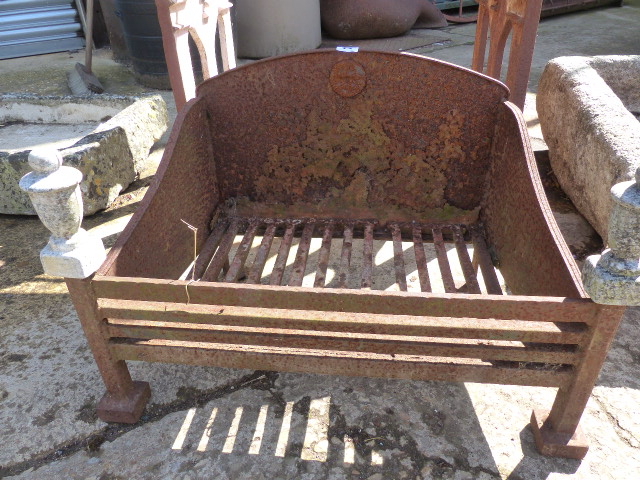 A CAST IRON FIRE BASKET.