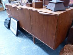 A MID CENTURY TEAK SIDEBOARD.