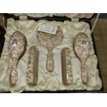 A SILVER MOUNTED DRESSING TABLE SET.