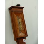 AN OAK STICK BAROMETER.