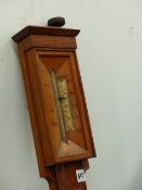 AN OAK STICK BAROMETER.